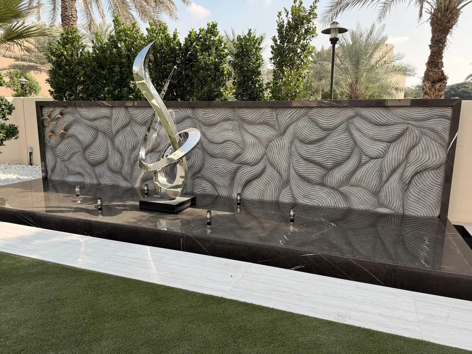 Artificial rock wall for a Dubai villa outdoor / pool feature — hand-sculpted, UV-stable